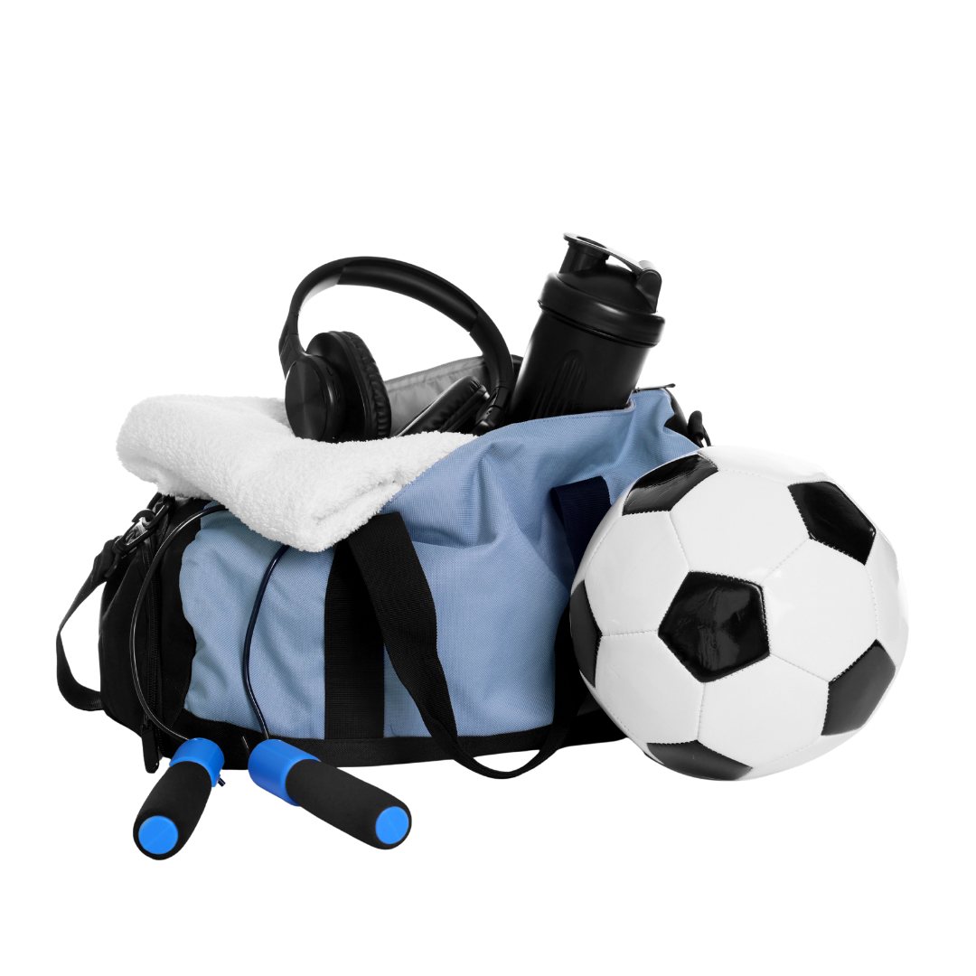 Blue duffel bag with soccer ball, headphones, and other items on a white background